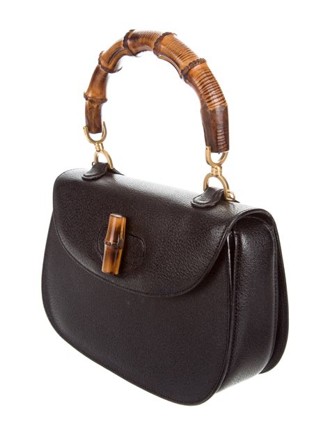 designer top handle handbags.